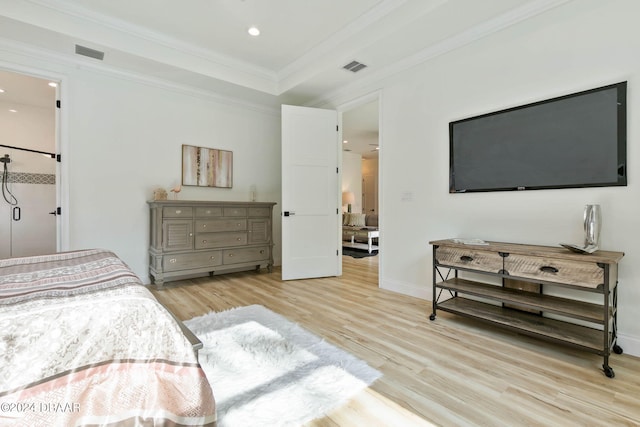 bedroom featuring ornamental molding and light hardwood / wood-style floors