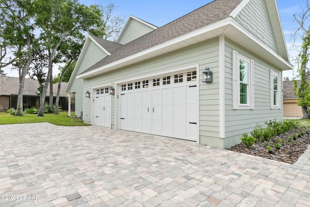 view of side of home with a garage