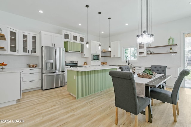6 Willow Trce, Flagler Beach, FL 32136 - kitchen featuring appliances with stainless steel finishes, open shelves, decorative backsplash, and recessed lighting