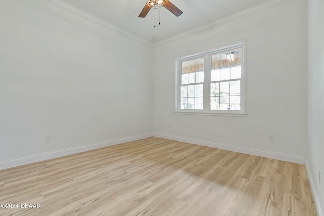 spare room featuring ceiling fan, light hardwood / wood-style flooring, and crown molding