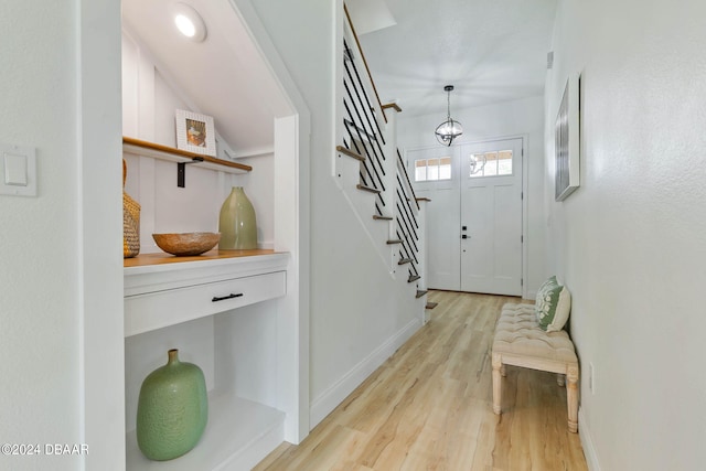 foyer entrance with light hardwood / wood-style floors