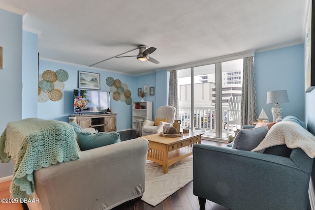 2800 N Atlantic Ave Unit 206, Daytona Beach, FL 32118 - living area featuring ornamental molding, a ceiling fan, wood finished floors, and baseboards