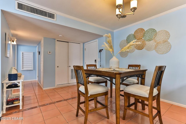 2800 N Atlantic Ave Unit 206, Daytona Beach, FL 32118 - dining room with light tile patterned floors, a chandelier, crown molding, and baseboards