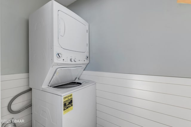 clothes washing area with stacked washer / drying machine