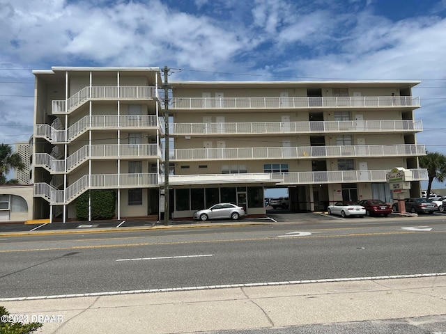 1233 S Atlantic Ave Unit 211, Daytona Beach, FL 32118 - view of apartment building / complex with a parking lot