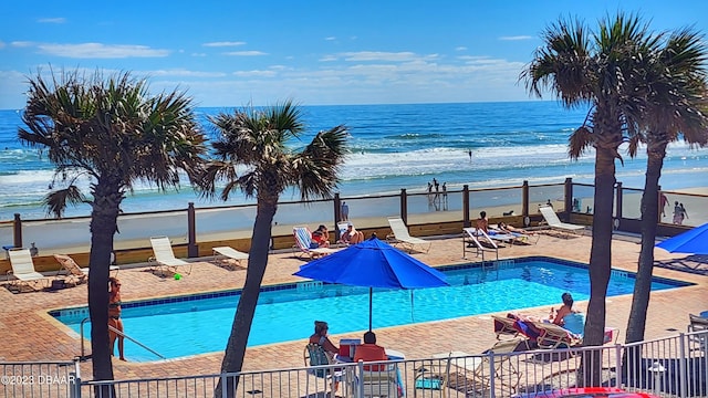 1233 S Atlantic Ave Unit 211, Daytona Beach, FL 32118 - community pool with a patio and view of water and beach