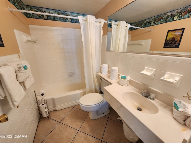 1233 S Atlantic Ave Unit 211, Daytona Beach, FL 32118 - bathroom featuring tile walls, shower / bath combo, tile patterned floors, and wainscoting