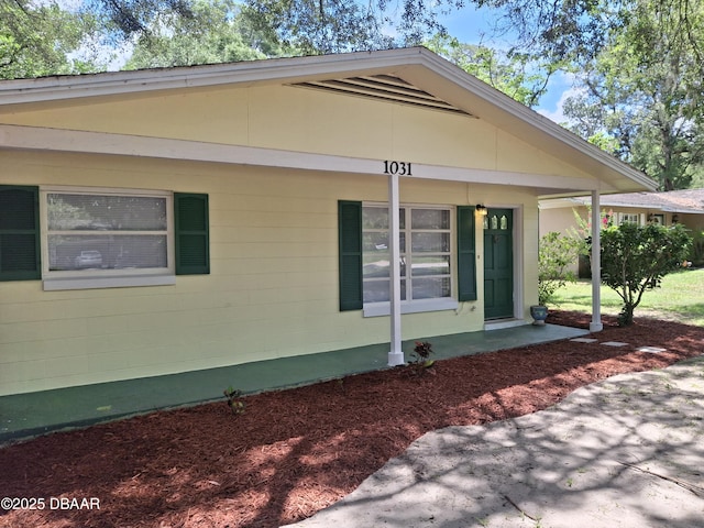 1031 NE 39th Ct, Ocala, FL 34470 - view of home's exterior featuring covered porch and concrete block siding