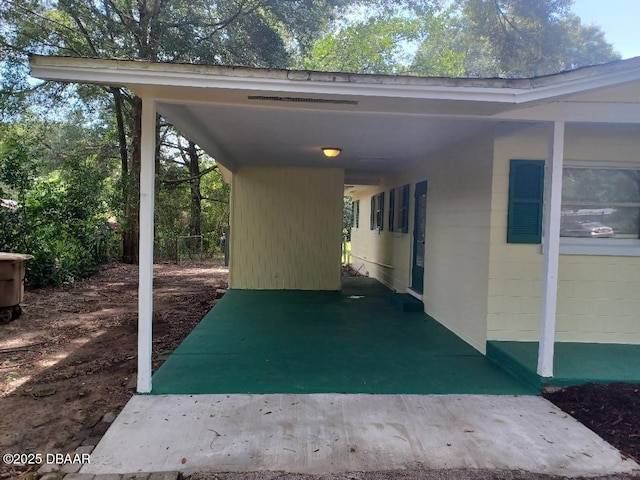 1031 NE 39th Ct, Ocala, FL 34470 - view of parking with a carport