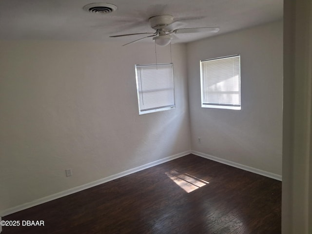 1031 NE 39th Ct, Ocala, FL 34470 - empty room featuring a ceiling fan and dark wood finished floors