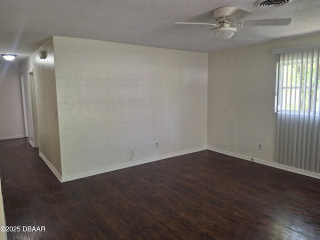 1031 NE 39th Ct, Ocala, FL 34470 - unfurnished room with ceiling fan, dark wood-type flooring, and a textured ceiling