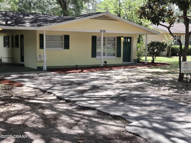 1031 NE 39th Ct, Ocala, FL 34470 - view of front of property featuring concrete block siding and roof with shingles