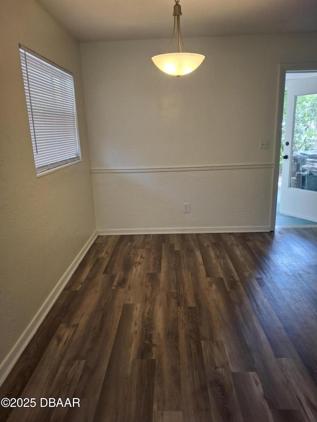 1031 NE 39th Ct, Ocala, FL 34470 - unfurnished dining area featuring dark wood-style floors