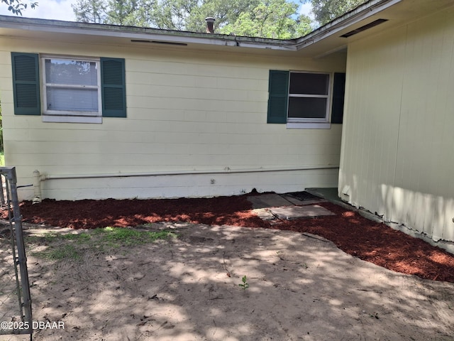 1031 NE 39th Ct, Ocala, FL 34470 - view of side of home with a patio