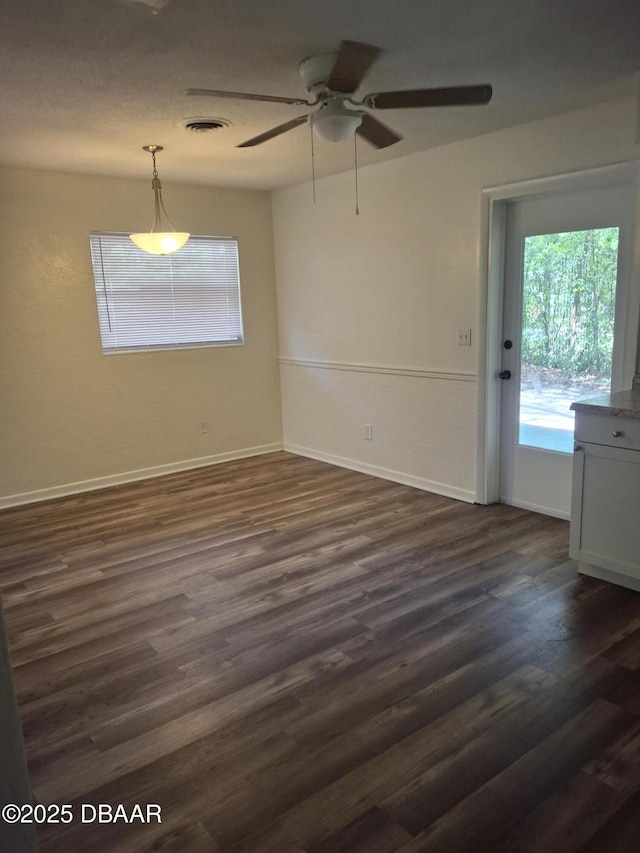 1031 NE 39th Ct, Ocala, FL 34470 - unfurnished room with a ceiling fan and dark wood finished floors