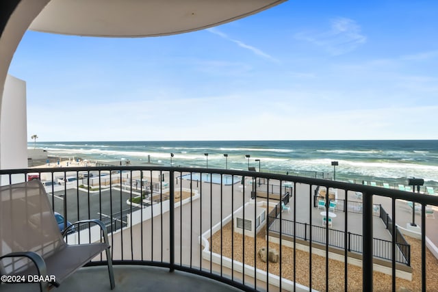 balcony with a view of the beach and a water view