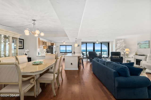 dining room featuring dark hardwood / wood-style floors, an inviting chandelier, and floor to ceiling windows