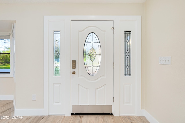 foyer with light hardwood / wood-style flooring