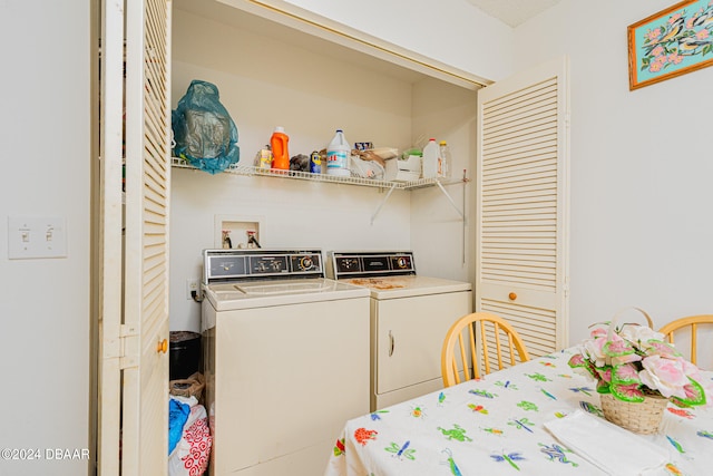 clothes washing area with washing machine and clothes dryer