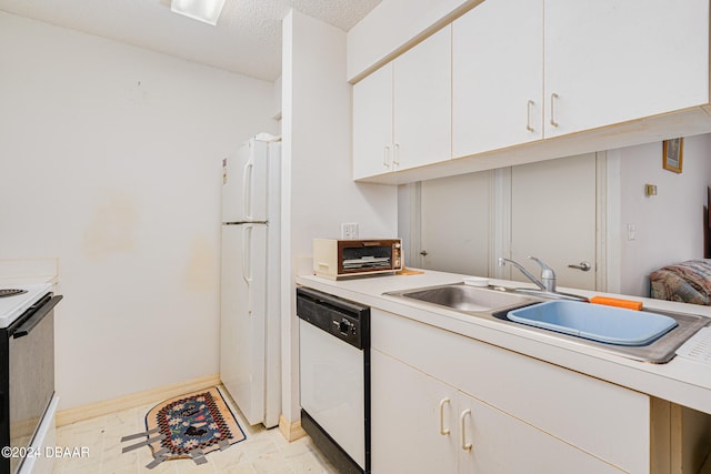 kitchen with white cabinets, a textured ceiling, white appliances, and sink