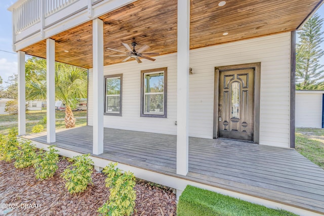 182 Howes St, Oak Hill, FL 32759 - doorway to property with covered porch and a ceiling fan