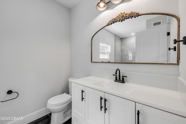 182 Howes St, Oak Hill, FL 32759 - bathroom with a tile shower, toilet, vanity, baseboards, and visible vents