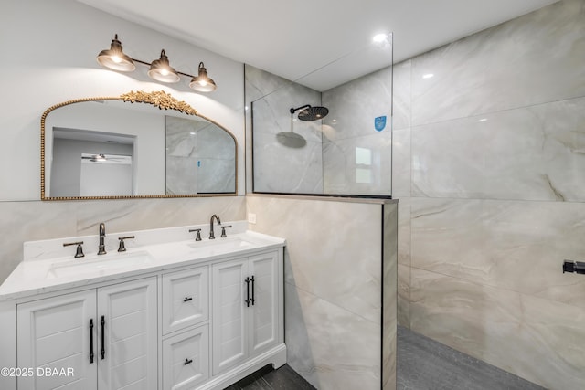 182 Howes St, Oak Hill, FL 32759 - bathroom featuring tile walls, a sink, and walk in shower
