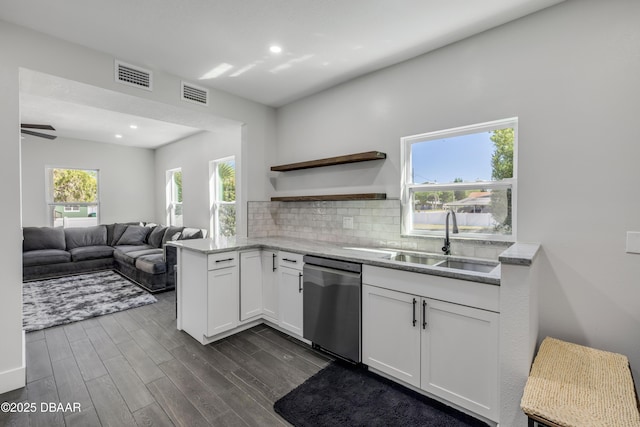 182 Howes St, Oak Hill, FL 32759 - kitchen featuring visible vents, a sink, tasteful backsplash, and dishwasher