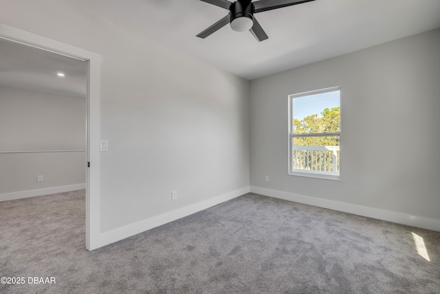 182 Howes St, Oak Hill, FL 32759 - spare room featuring baseboards, carpet flooring, and a ceiling fan