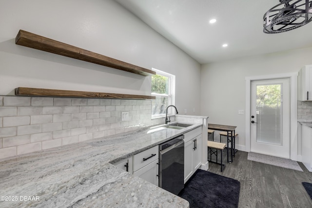 182 Howes St, Oak Hill, FL 32759 - kitchen with white cabinetry, open shelves, decorative backsplash, a sink, and dishwasher