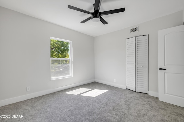 182 Howes St, Oak Hill, FL 32759 - unfurnished bedroom featuring baseboards, visible vents, a closet, and carpet floors