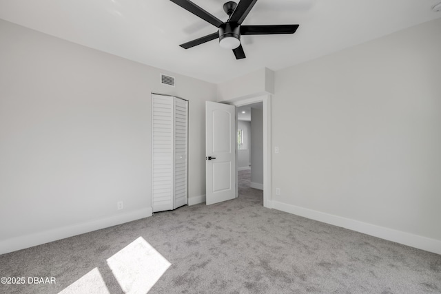182 Howes St, Oak Hill, FL 32759 - unfurnished bedroom featuring carpet, baseboards, visible vents, a ceiling fan, and a closet