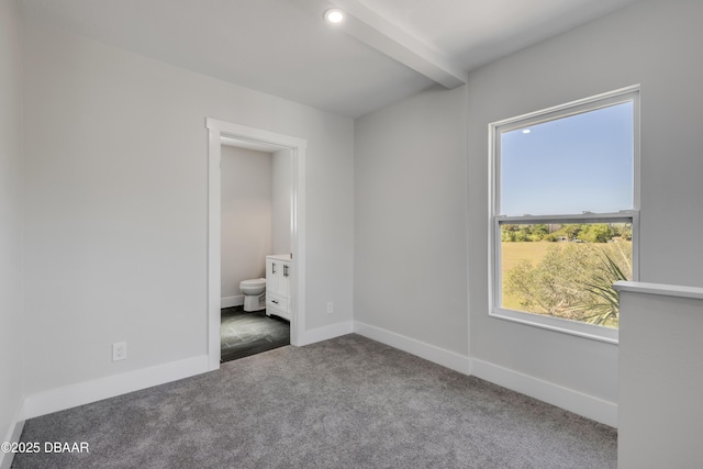 182 Howes St, Oak Hill, FL 32759 - unfurnished bedroom with carpet flooring, ensuite bath, baseboards, beamed ceiling, and recessed lighting