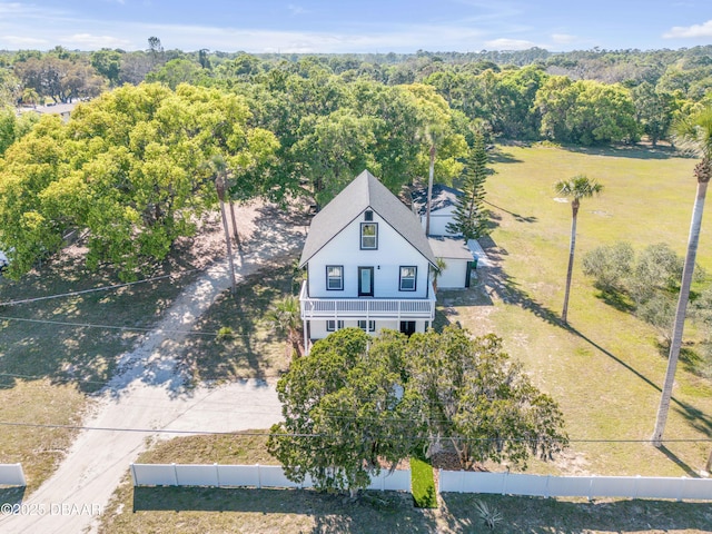 182 Howes St, Oak Hill, FL 32759 - bird's eye view with a wooded view