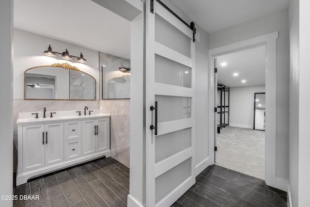 182 Howes St, Oak Hill, FL 32759 - bathroom with double vanity, a sink, and wood tiled floor