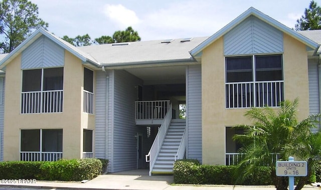 view of building exterior with stairway