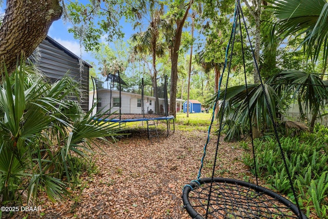 292 Fir St, Ormond Beach, FL 32174 - view of yard with a trampoline