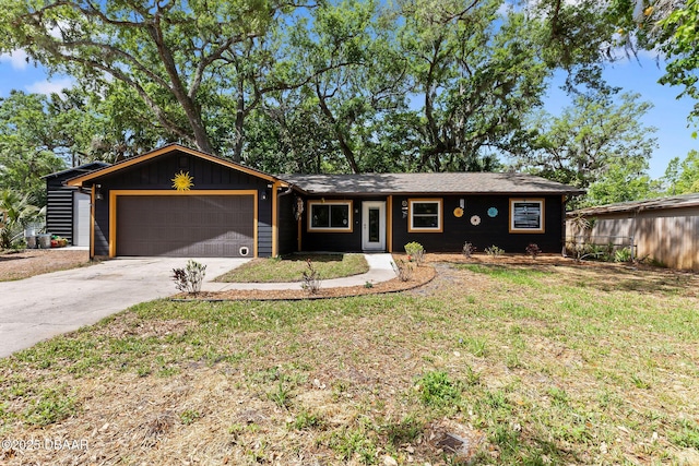 292 Fir St, Ormond Beach, FL 32174 - ranch-style home featuring an attached garage, concrete driveway, and a front yard