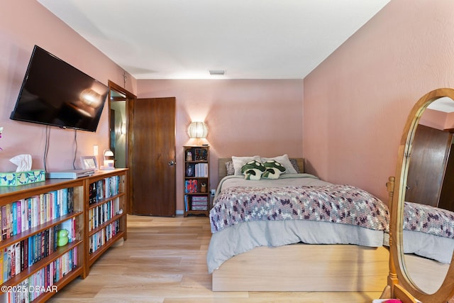 292 Fir St, Ormond Beach, FL 32174 - bedroom with light wood-style floors and arched walkways