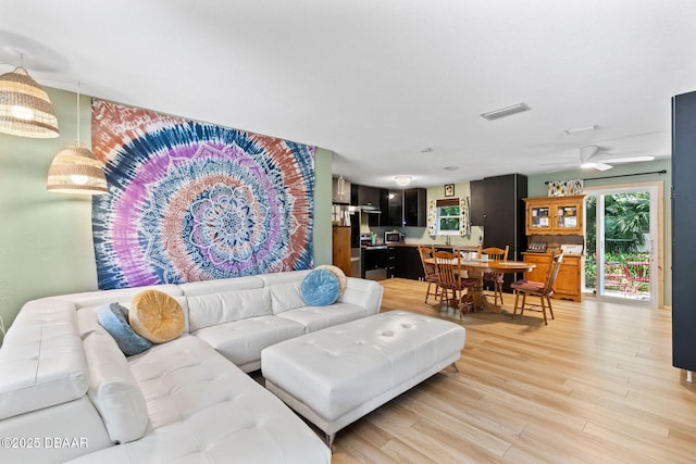292 Fir St, Ormond Beach, FL 32174 - living area featuring light wood-style flooring and a ceiling fan