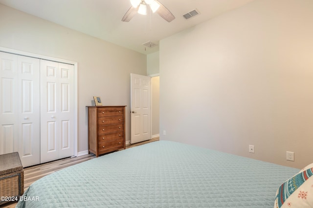 bedroom with ceiling fan, a closet, and light wood-type flooring