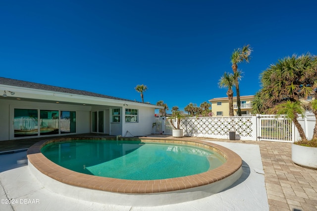 view of swimming pool with a patio area