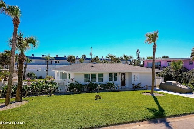 view of front of property featuring a garage and a front lawn