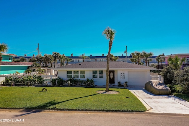 ranch-style house with a garage and a front lawn