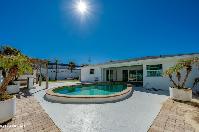 view of swimming pool featuring a pergola and a patio area