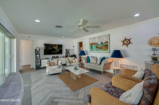 living room featuring parquet flooring and ceiling fan