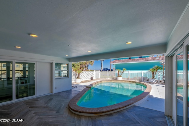 view of swimming pool with a patio area