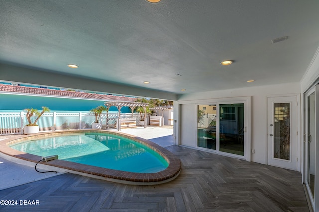 view of pool featuring a patio and a pergola