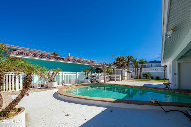 view of swimming pool with a pergola and a patio