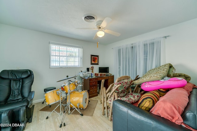 interior space with ceiling fan and light hardwood / wood-style flooring